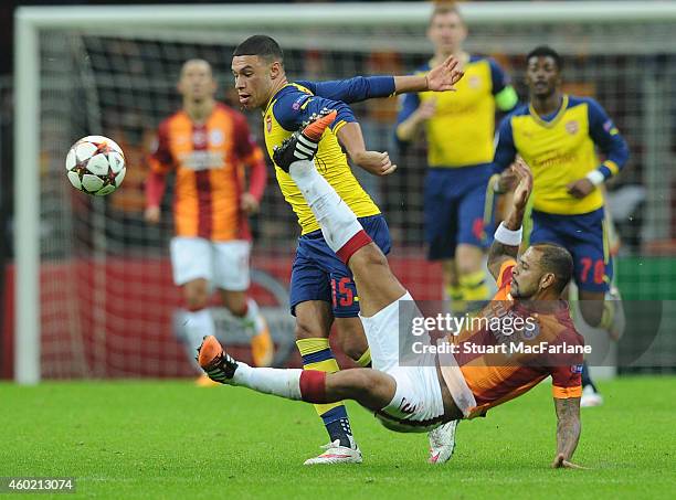 Alex Oxlade-Chamberlain of Arsenal challenged by Felipe Melo during the UEFA Champions League match between Galatasaray and Arsenal at the Turk...