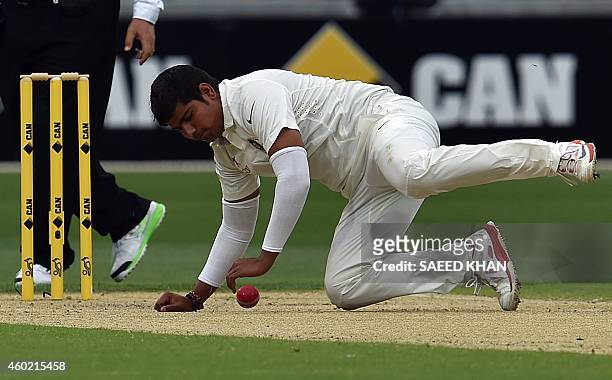 India's legspinner Karn Sharma fields the ball on the second day of play in the first Test cricket match between Australia and India at the Adelaide...