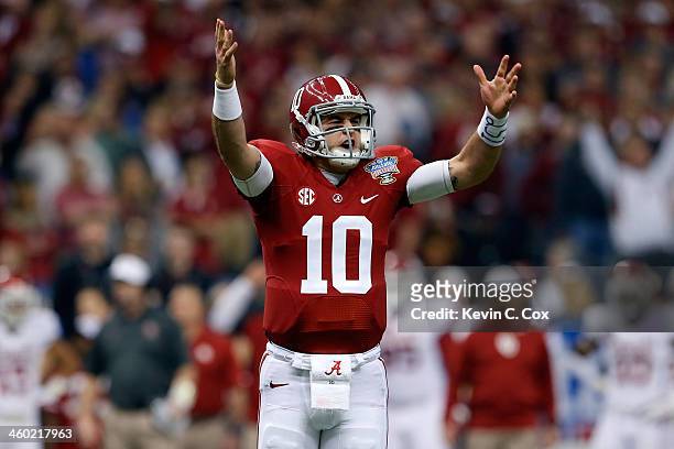 McCarron of the Alabama Crimson Tide celebrates after a touchdown against the Oklahoma Sooners during the Allstate Sugar Bowl at the Mercedes-Benz...