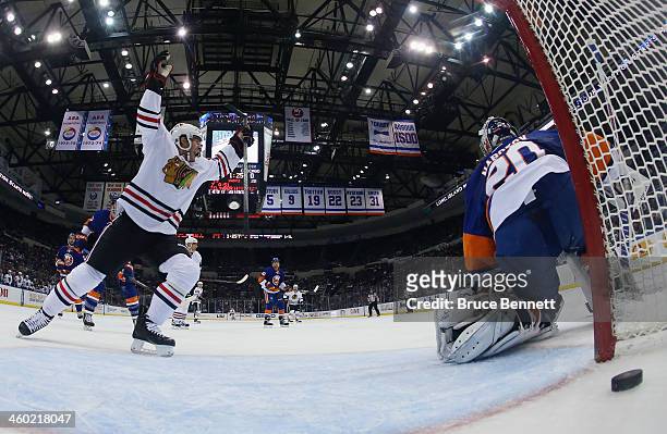 Brandon Saad celebrates a powerplay goal by Brent Seabrook of the Chicago Blackhawks at 18:36 of the second period against Evgeni Nabokov of the New...