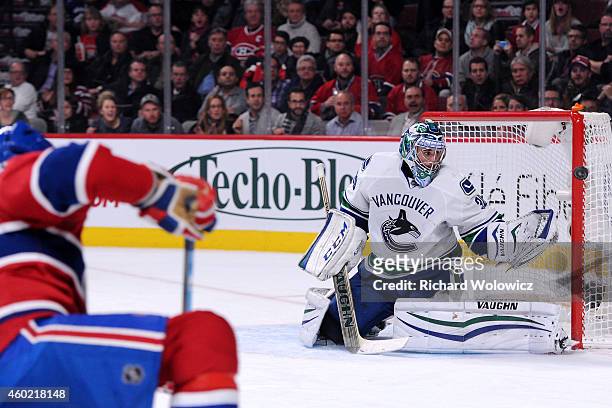 Ryan Miller of the Vancouver Canucks watches the rebounding puck on a shot by Max Pacioretty of the Montreal Canadiens during the NHL game at the...