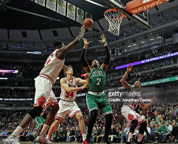 Jared Sullinger of the Boston Celtics rebounds surrounded by Nazr Mohammed; Mike Dunleavy and D.J. Augustin of the Chicago Bulls at the United Center...
