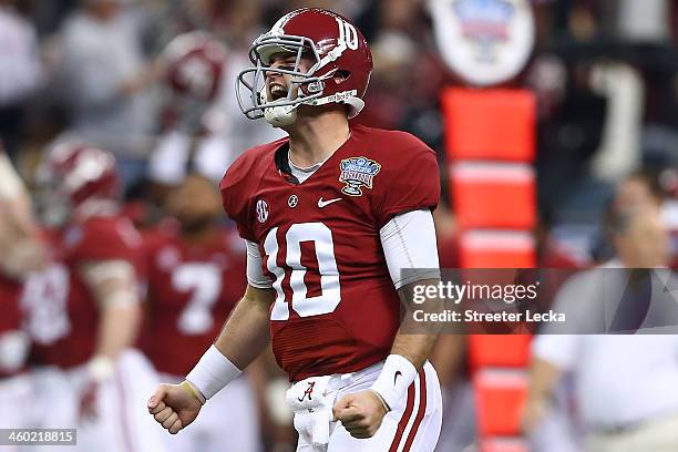 McCarron of the Alabama Crimson Tide celebrates after throwing a touchdown pass against the Oklahoma Sooners during the Allstate Sugar Bowl at the...