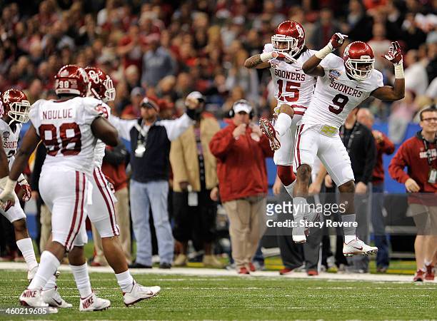 Zack Sanchez and Gabe Lynn of the Oklahoma Sooners celebrate against the Alabama Crimson Tide during the Allstate Sugar Bowl at the Mercedes-Benz...