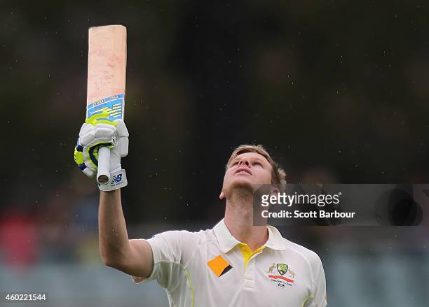 Steven Smith of Australia celebrates his century and pays tribute to the late Phillip Hughes during day two of the First Test match between Australia...