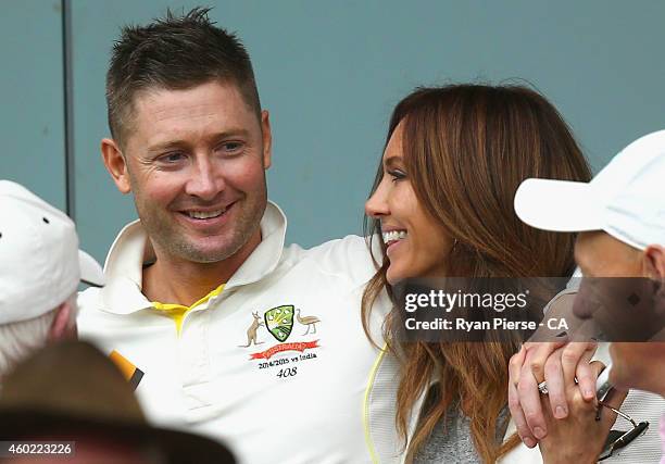 Michael Clarke of Australia and his wife Kyly Clarke, speak during a rain delay during day two of the First Test match between Australia and India at...