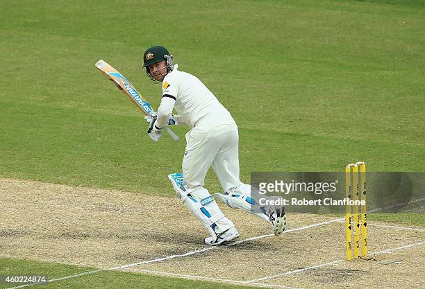 Michael Clarke of Australia hits a single to bring up his century during day two of the First Test match between Australia and India at Adelaide Oval...