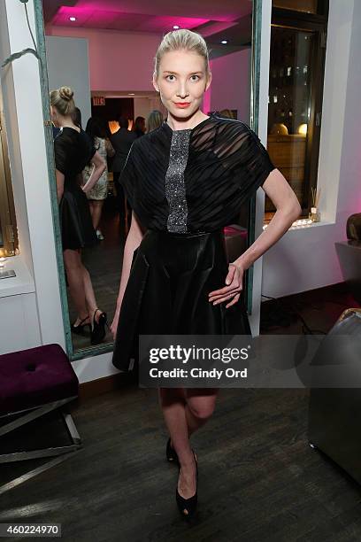 Model wearing Edward Roth poses for a photo at The 2nd Annual NBA, NFL and MLB Wives Holiday Soiree, in support of benevolent charity, "Dress For...