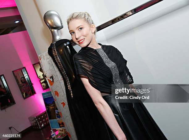 Model wearing Edward Roth poses for a photo at The 2nd Annual NBA, NFL and MLB Wives Holiday Soiree, in support of benevolent charity, "Dress For...