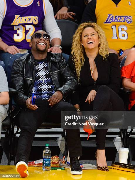 Floyd Mayweather, Jr. And Liza Hernandez attend a basketball game between the Sacramento Kings and the Los Angeles Lakers at Staples Center on...