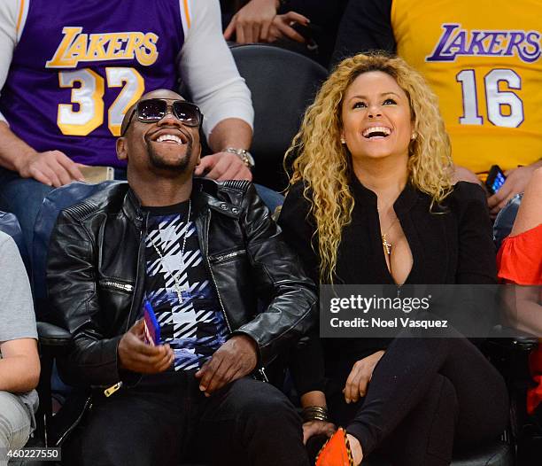 Floyd Mayweather, Jr. And Liza Hernandez attend a basketball game between the Sacramento Kings and the Los Angeles Lakers at Staples Center on...