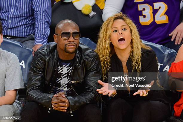 Floyd Mayweather, Jr. And Liza Hernandez attend a basketball game between the Sacramento Kings and the Los Angeles Lakers at Staples Center on...