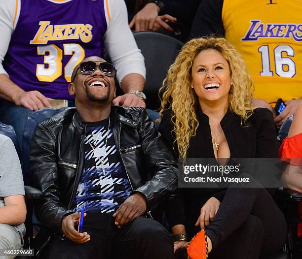Floyd Mayweather, Jr. And Liza Hernandez attend a basketball game between the Sacramento Kings and the Los Angeles Lakers at Staples Center on...
