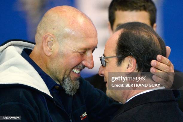 Serge Lazarevic , France's last remaining hostage, embraces French President Francois Hollande, after Lazarevic landed in a French Republic plane at...