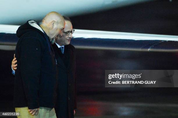 Serge Lazarevic , France's last remaining hostage, talks with French President Francois Hollande after Lazarevic landed in a French Republic plane at...