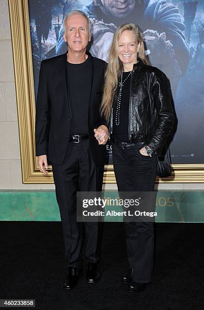 Director James Cameron and actress/wife Suzy Amis arrive for Premiere Of New Line Cinema, MGM Pictures And Warner Bros. Pictures' "The Hobbit: The...