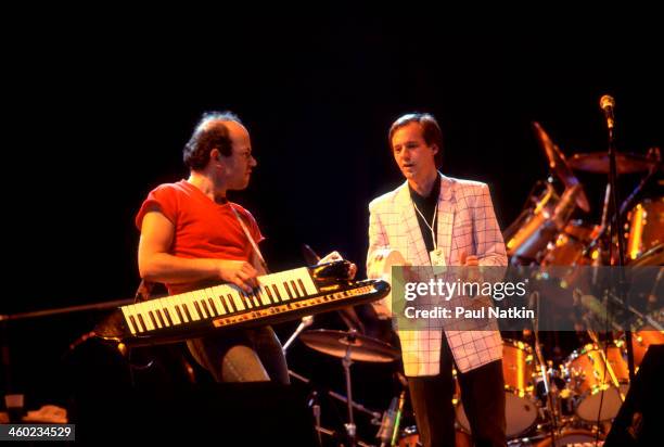 Musicians Jan Hammer and Andy Fairweather-Low perform on stage during an ARMS Charity Concert, Dallas, Texas, November 27, 1983.