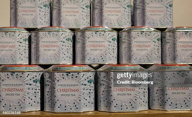Tins of Christmas spiced tea sit on display inside a pop-up store, operated by Fortnum & Mason Plc, during a seasonal Christmas event at Somerset...