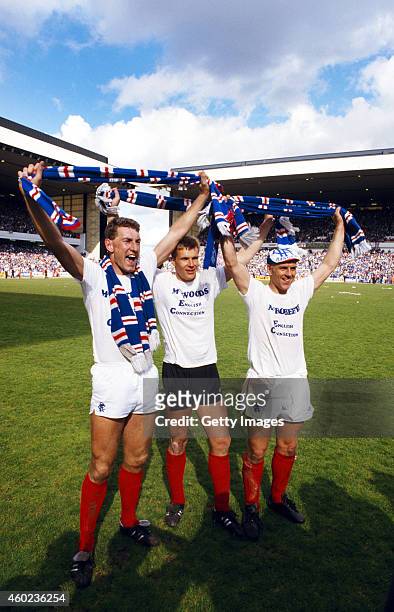 English trio Terry Butcher Chris Woods and Graham Roberts celebrate after the Scottish Premier League match between Rangers and St Mirren at Ibrox as...