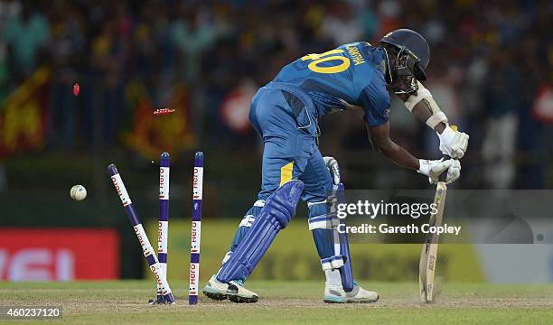Ajantha Mendis of Sri Lanka is bowled by Chris Woakes of England during the 5th One Day International between Sri Lanka and England at Pallekele...