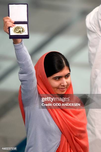 Nobel Peace Prize laureate Malala Yousafzai holds her Nobel Prize at the Nobel Peace Prize awarding ceremony at the City Hall in Oslo on December 10,...