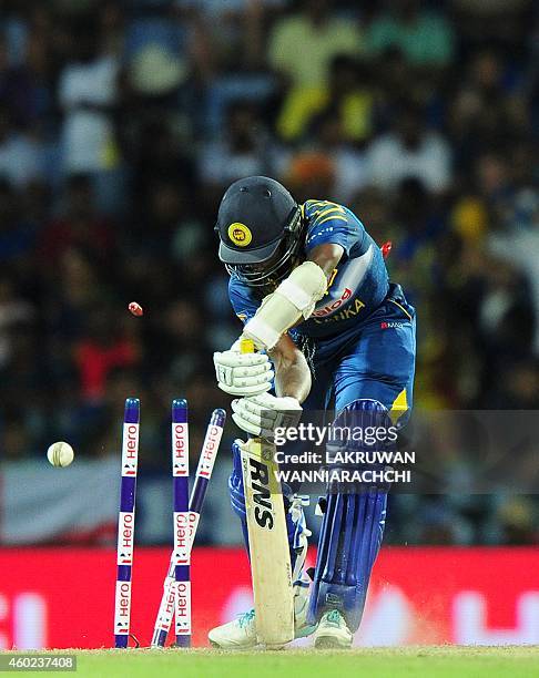 Sri Lankan cricketer Ajantha Mendis is bowled by England cricketer Chris Woakes during the fifth One Day International match between Sri Lanka and...