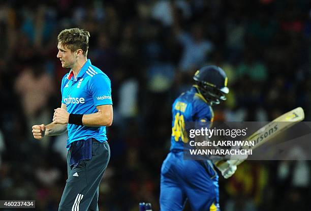 England cricketer Chris Woakes celebrates after he dismissed Sri Lankan cricketer Ajantha Mendis during the fifth One Day International match between...