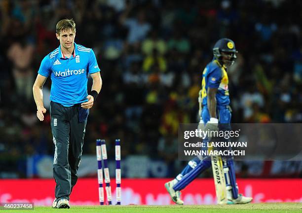 England cricketer Chris Woakes celebrates after he dismissed Sri Lankan cricketer Ajantha Mendis during the fifth One Day International match between...
