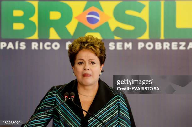 Brazilian President Dilma Rousseff cries while delivering a speech during the ceremony presenting the final report of the National Truth Commission...
