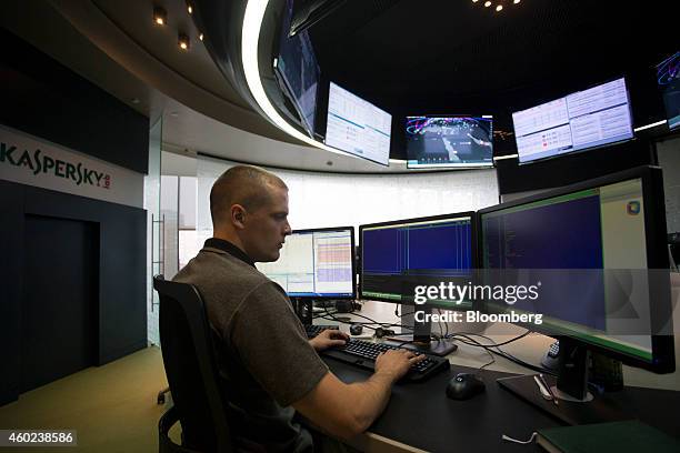 An employee works at computer screens at the headquarters of Kaspersky Lab, a cyber-security firm, in Moscow, Russia, on Tuesday, Dec. 9, 2014....