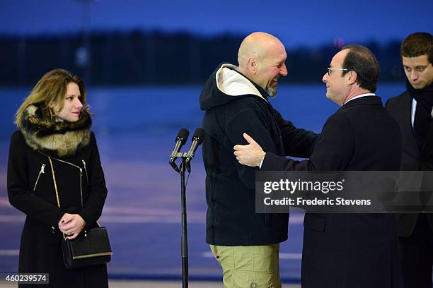 Former hostage, Serge Lazarevic is welcomed by French President Francois Hollande as his daughter Diane and Clement Verdon , son of French executed...