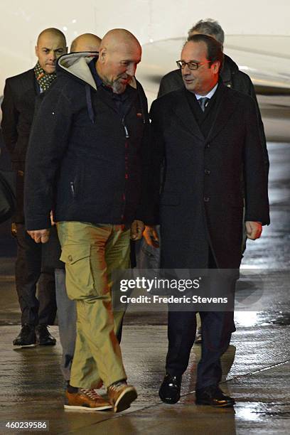 Former hostage, Serge Lazarevic is welcomed by French President Francois Hollande after landing at the Villacoublay military base near Paris on...