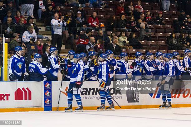 Tarmo Reunanen; Otto Somppi and Kristian Vesalainen of Finland celebrate a goal against Canada White during the World Under-17 Hockey Challenge on...