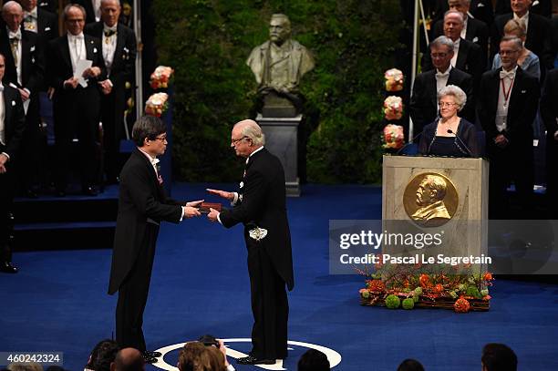 Professor Hiroshi Amano, laureate of the Nobel Prize in Physics receives his Nobel Prize from King Carl XVI Gustaf of Sweden during the Nobel Prize...