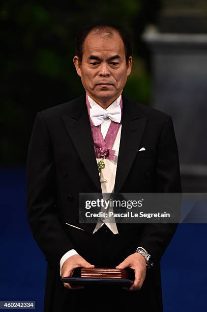 Professor Shuji Nakamura, laureate of the Nobel Prize in Physics acknowledges applause after he received his Nobel Prize from King Carl XVI Gustaf of...