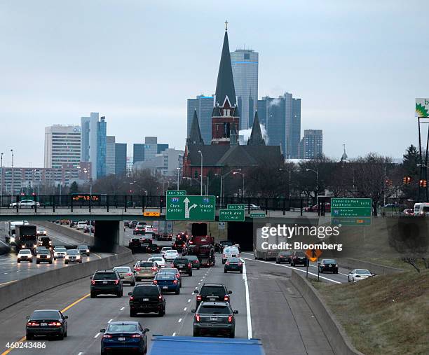 Traffic moves along a highway toward downtown Detroit, Michigan, U.S., on Wednesday, Dec. 10, 2014. Detroit has filed legal papers seeking to end its...