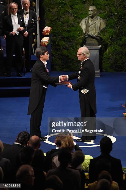 Professor Hiroshi Amano, laureate of the Nobel Prize in Physics receives his Nobel Prize from King Carl XVI Gustaf of Sweden during the Nobel Prize...