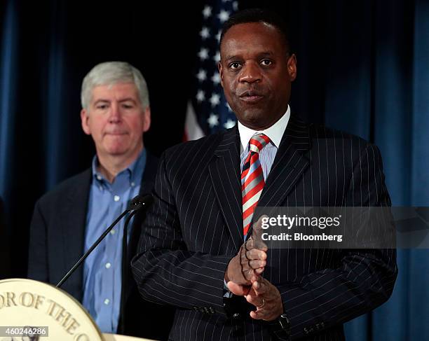 Kevyn Orr, emergency manager for Detroit, speaks during a news conference with Rick Snyder, governor of Michigan, back left, at police headquarters...