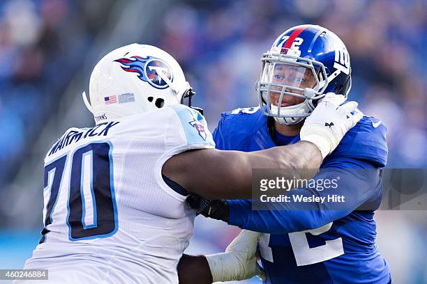 Kerry Wynn of the New York Giants is blocked by Chance Warmack of the Tennessee Titans at LP Field on December 7, 2014 in Nashville, Tennessee. The...