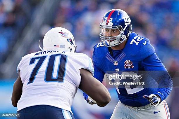 Kerry Wynn of the New York Giants is blocked by Chance Warmack of the Tennessee Titans at LP Field on December 7, 2014 in Nashville, Tennessee. The...