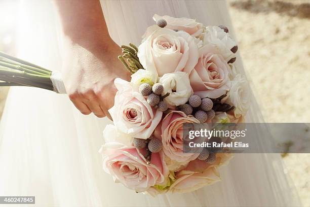 bridal bouquet - bride holding bouquet stock pictures, royalty-free photos & images