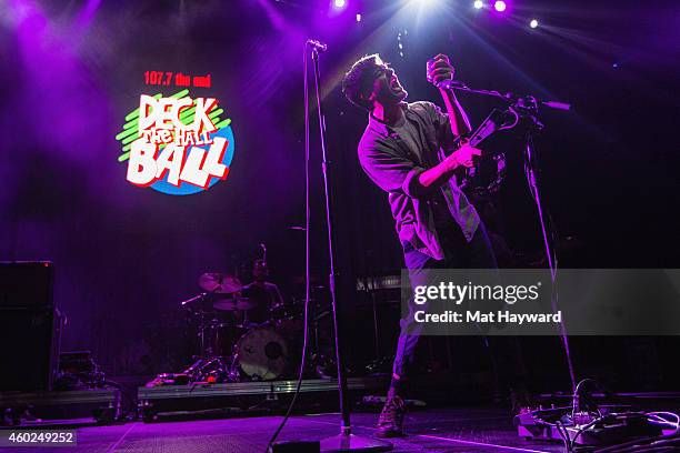 Sameer Gadhia of Young The Giant performs on stage during Deck The Hall Ball hosted by 107.7 The End at Key Arena on December 9, 2014 in Seattle,...