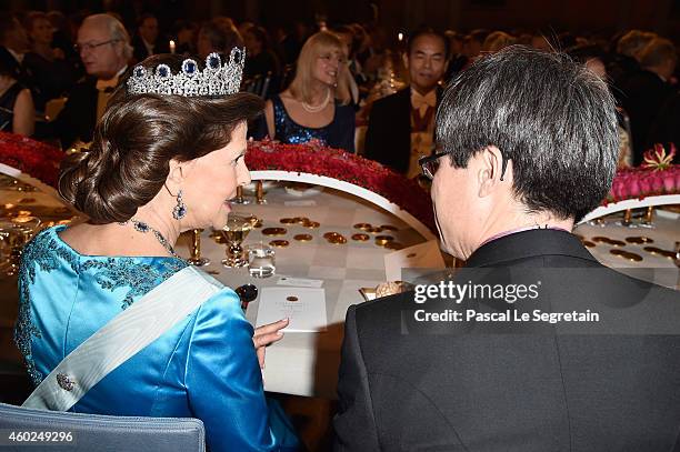 Professor Hiroshi Amano and Queen Silvia of Sweden attend the Nobel Prize Banquet 2014 at City Hall on December 10, 2014 in Stockholm, Sweden.