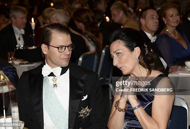 The 2014 Nobel laureate in medicine May-Britt Moser from Norway speaks Prince Daniel of Sweden during the traditional Nobel banquet at the Stockholm...