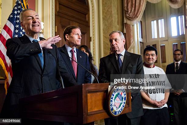 Sen. Charles Schumer speaks as Sen. Richard Blumenthal , Sen. Dick Durbin and United Farm Worker member Raul Esparza look on during a news conference...