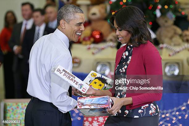 President Barack Obama and first lady Michelle Obama sort toys and gifts donated by Executive Office of the President staff to the Marine Corps...