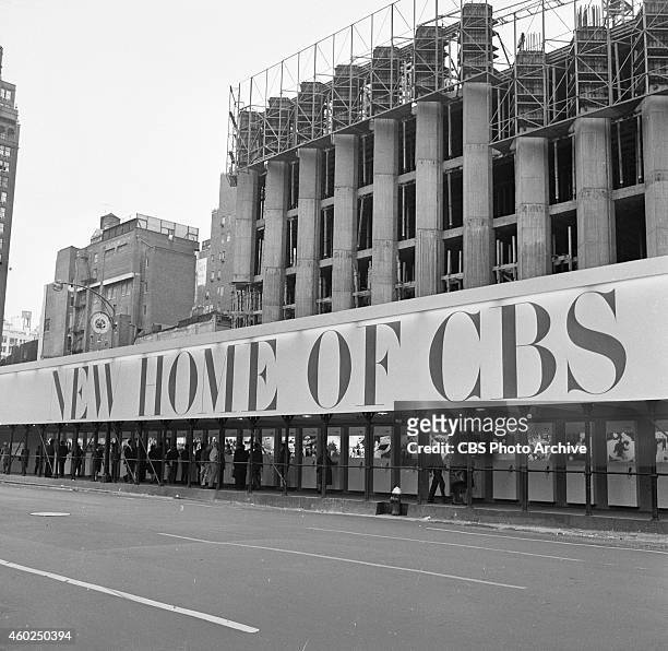 New Home of CBS" on sidewalk shed at construction site of CBS headquarters, 51 West 52 Street, New York, NY. Image dated October 17, 1963.