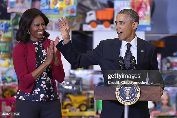 President Barack Obama and first lady Michelle Obama deliver remarks before sorting toys and gifts donated by Executive Office of the President staff...