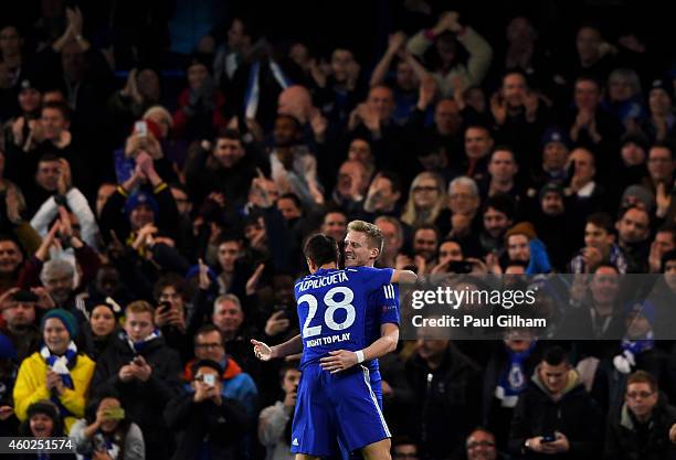 Andre Schuerrle of Chelsea celebrates with teammate Cesar Azpilicueta of Chelsea after scoring his team's second goal during the UEFA Champions...