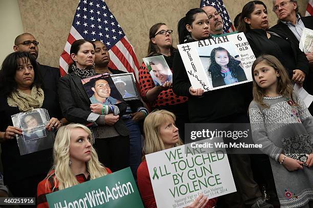 Family members who have lost loved ones to gun violence gather with members of Congress during a press conference four days before the second...